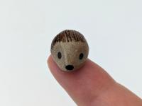 Cute handmade mini ceramic hedgehog figurine. Unique desk buddy. Good luck charm. Small-batch ceramics. Hand-painted pottery.