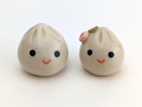 Two cute handmade ceramic dumplings - One with flower. Happy soup dumplings. Xiao long bao. Small-batch ceramics. Hand-painted pottery.