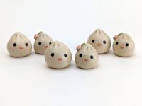 Two cute handmade ceramic dumplings - One with flower. Happy soup dumplings. Xiao long bao. Small-batch ceramics. Hand-painted pottery.