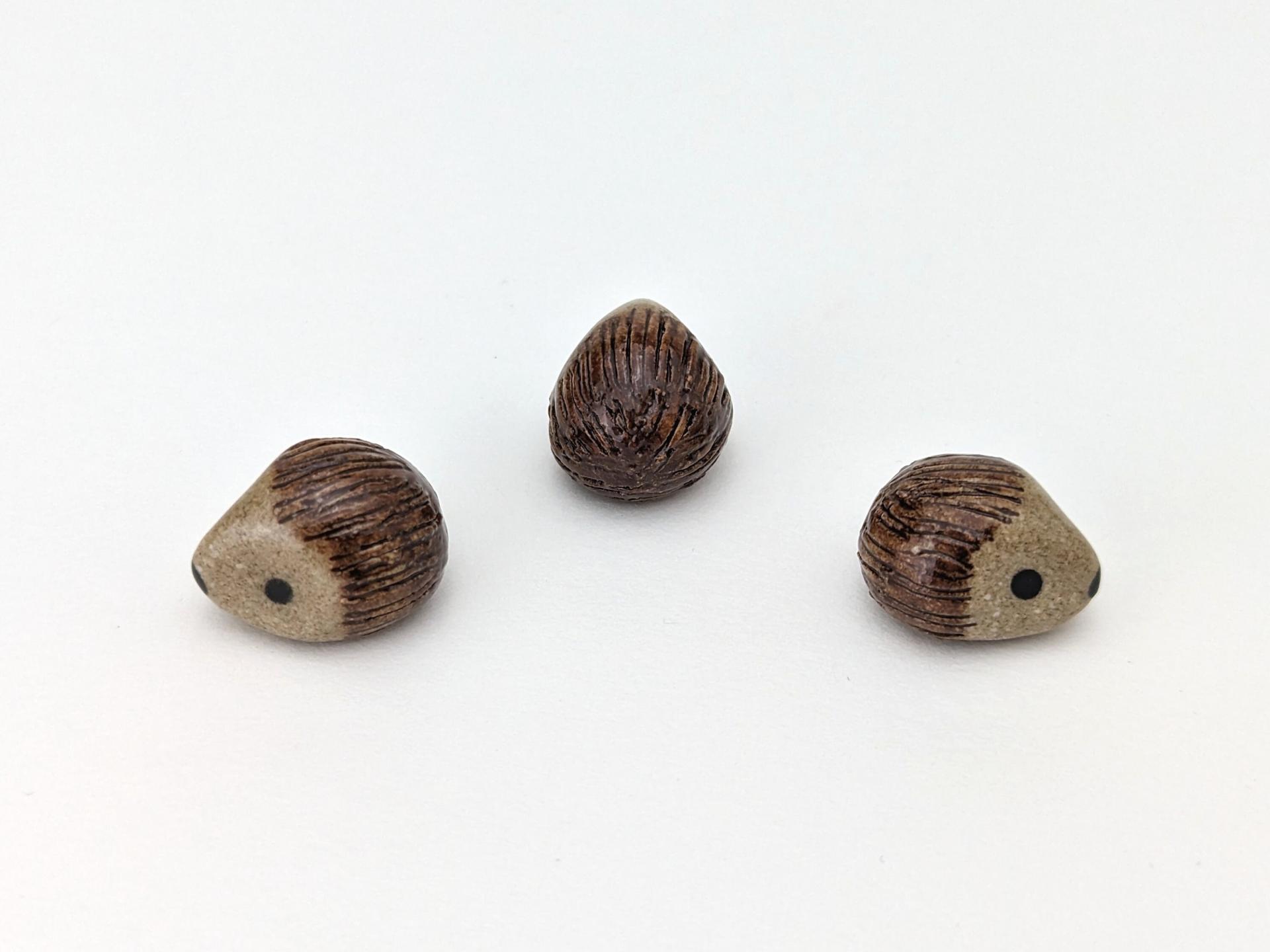 Cute handmade mini ceramic hedgehog figurine. Unique desk buddy. Good luck charm. Small-batch ceramics. Hand-painted pottery.