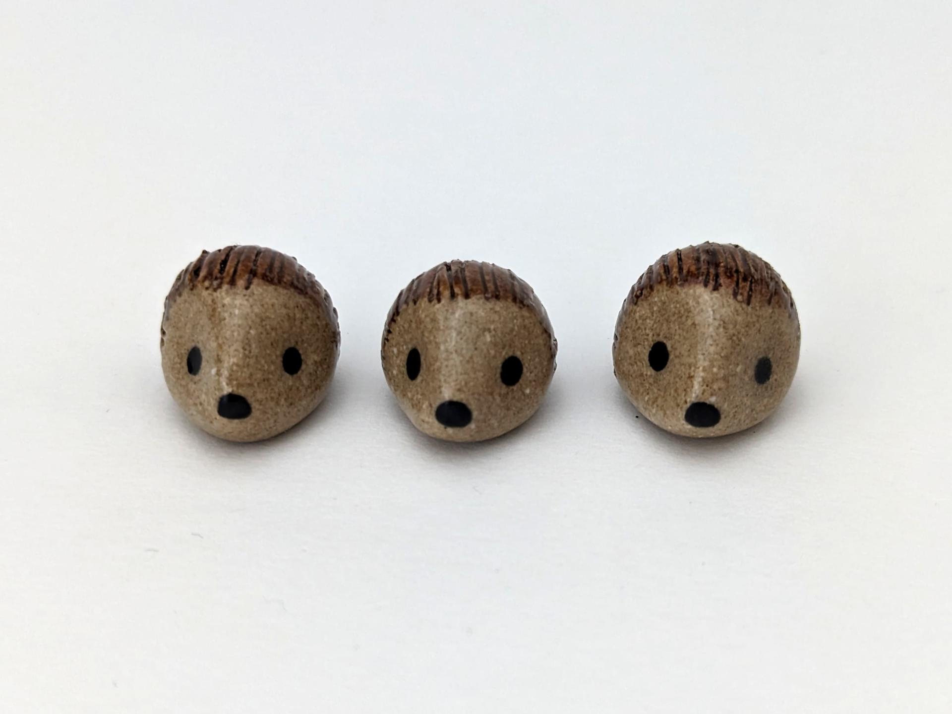 Cute handmade mini ceramic hedgehog figurine. Unique desk buddy. Good luck charm. Small-batch ceramics. Hand-painted pottery.