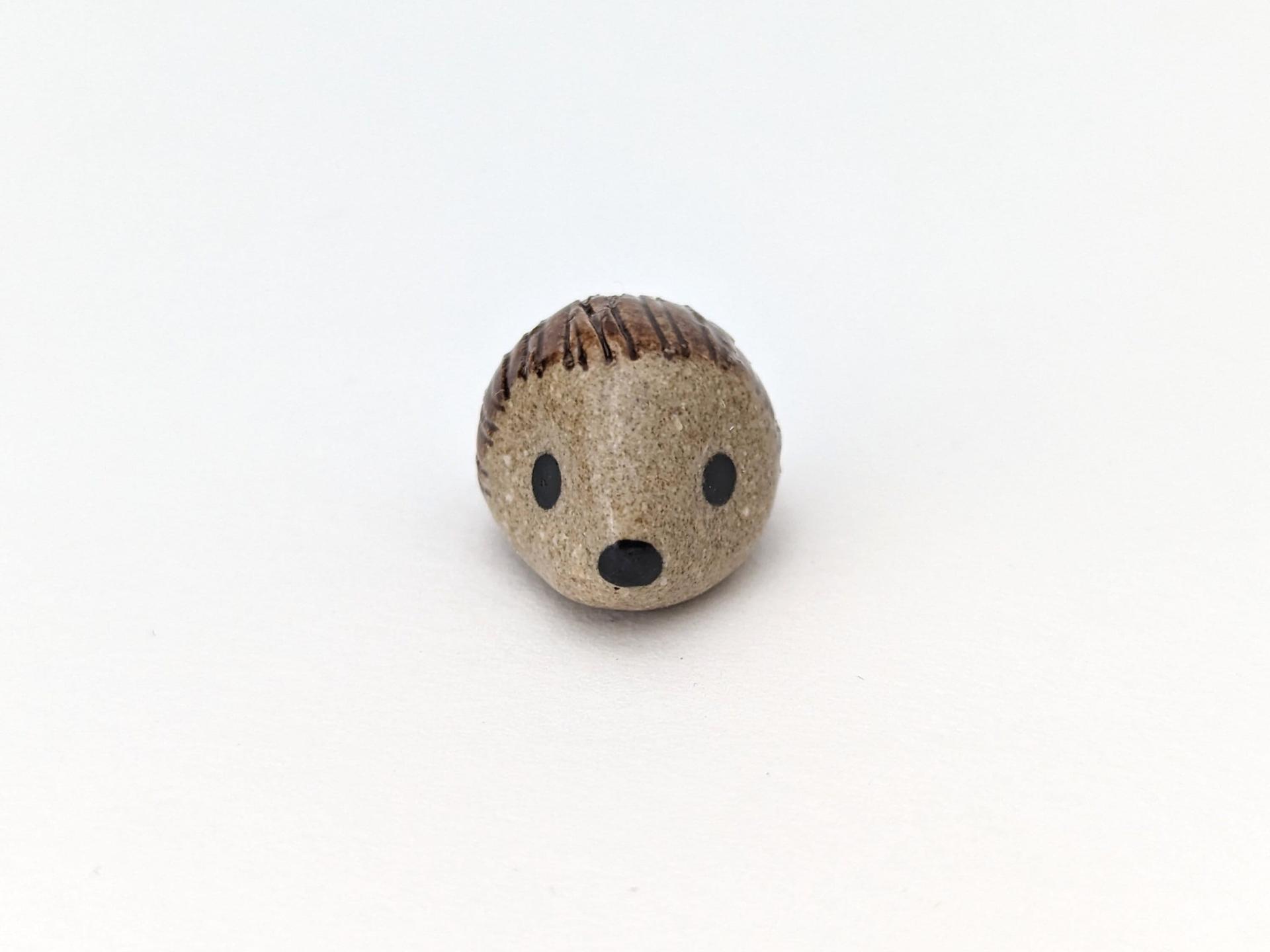 Cute handmade mini ceramic hedgehog figurine. Unique desk buddy. Good luck charm. Small-batch ceramics. Hand-painted pottery.